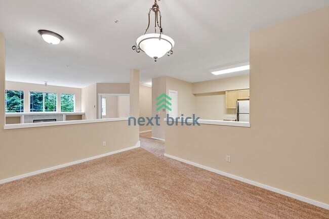 Building Photo - Rare Ground-Floor, End Unit with massive b...