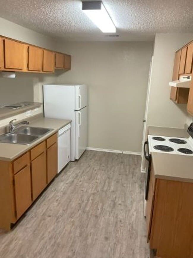 Building Photo - This incredible three bedroom home is minutes away from Lake Travis