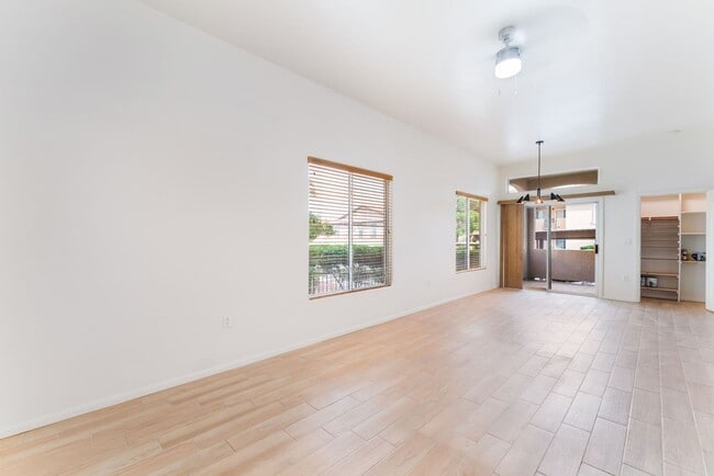 Building Photo - Charming Ground-Floor Condo with Wood Flooring & Modern Comforts!