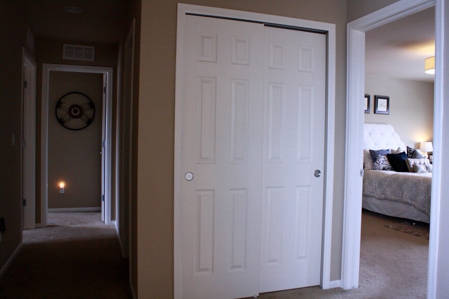 Upstairs landing & closet, shared bath on right of hall, both bedrooms on left and straight. Master bed to the right. - 5132 Exploration Lane