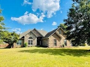 Building Photo - Enjoy summer days with a pool