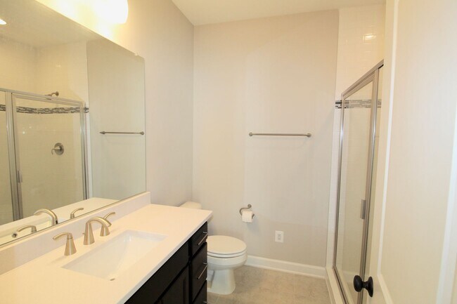 Building Photo - 3 bedroom town home with a finished basement and garage located in popular Preston Lakes