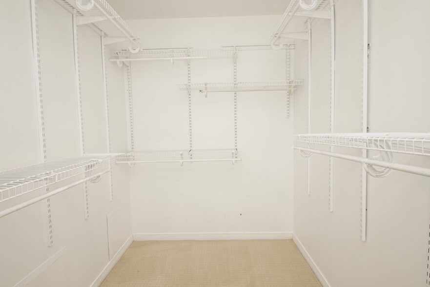 walk in closet with racks for storage and organization!! - 23 Ruby Cir
