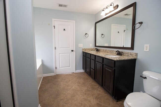 Building Photo - Elegant All-Brick 4 Bedroom Home on a Quie...