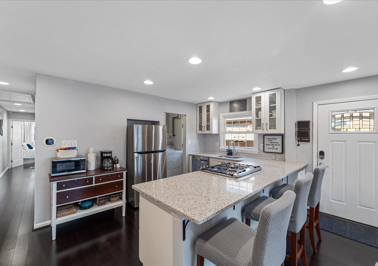 Kitchen has stainless steel appliances including a gas stove, dishwasher and fridge. - 706A W Glebe Rd