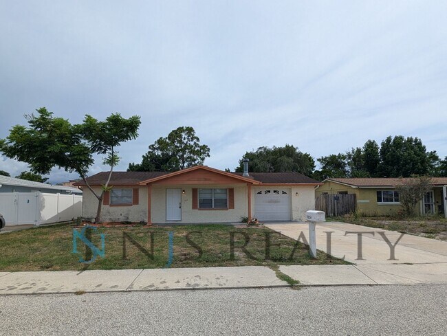 Building Photo - 3 bed,2 bath ~ With garage, workshop & shed!! NEW floors, NEW paint! Updated bathroom & kitchen w...