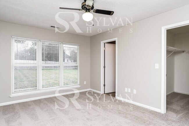 Building Photo - This home exudes a cheerful and welcoming charm!