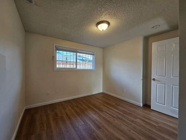 Building Photo - Charming Single-Level Home Featuring New Hardwood Floors, Bright Bedrooms & Open-Concept Living