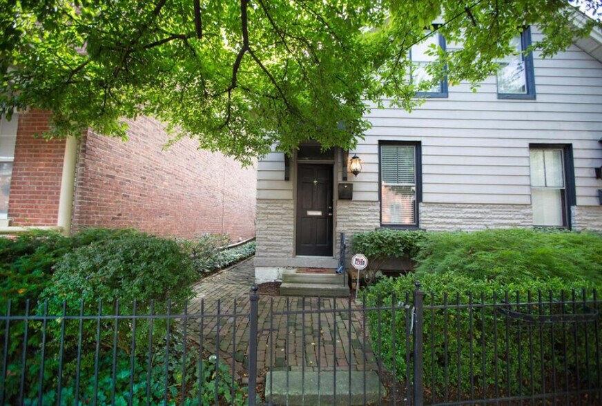 A brick path leads to this welcoming entrance. - 715 S 5th St