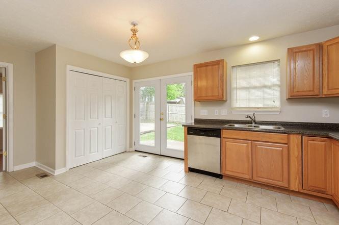 Kitchen and laundry area - 1613 Cedar Tree Ln