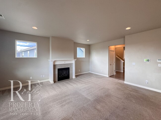 Building Photo - Vaulted Ceilings, Tree-Lined Views & a Spacious Primary Suite Retreat