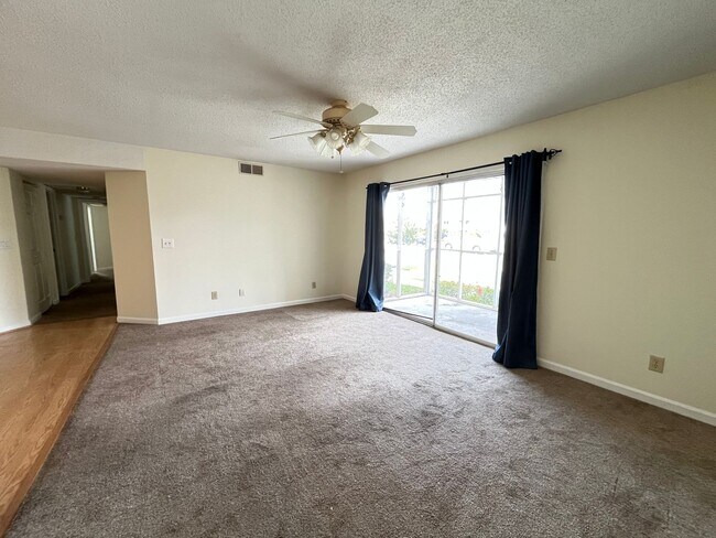Building Photo - First Floor, Unfurnished, 3 Bedroom, 2 Bath Condo with Screened-in Back Patio!
