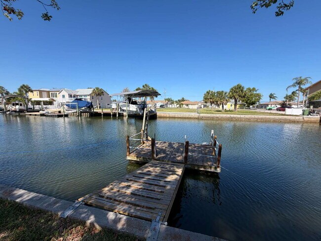 Building Photo - "Waterfront Home with Dock! 3-Bedroom Oasis with 2 Baths and 1,800 Sq Ft of Comfort in Hudson, FL!"