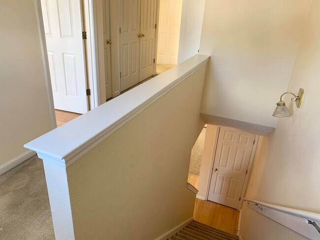 Upstairs hall, all beds are up, laundry closet in the hallway and second bath - 7985 Marsha Woods Dr
