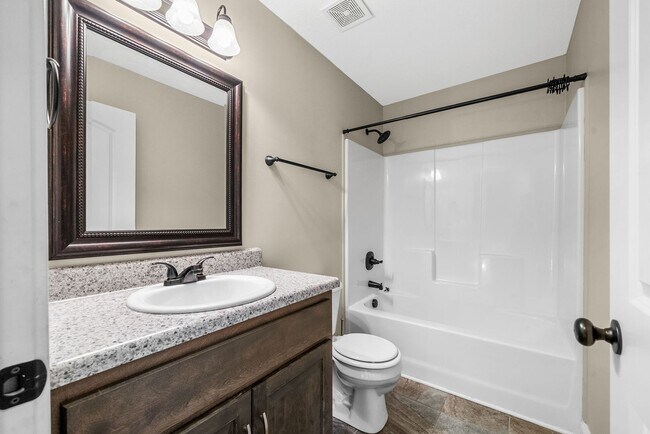 Building Photo - Spacious 4-Bedroom Home with Modern Upgrad...