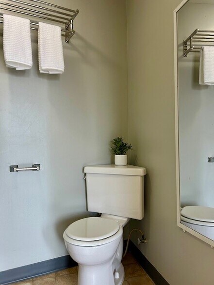 Bathroom complete with towel shelf and mirror - 4537 SE 65th Ave