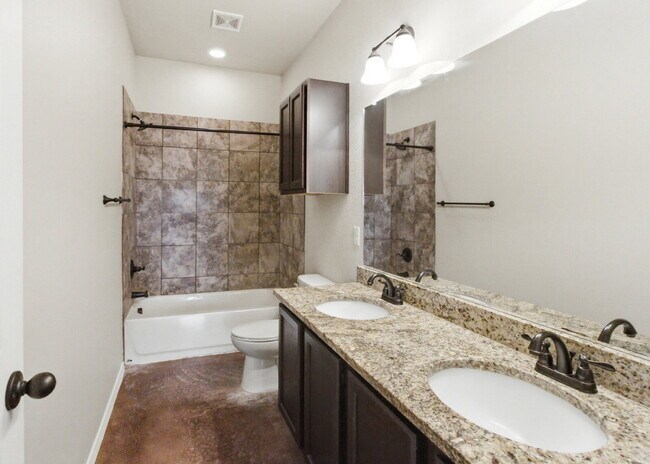 Building Photo - 3 Bedroom Duplex with Stained Concrete Floors and Greenbelt Views!