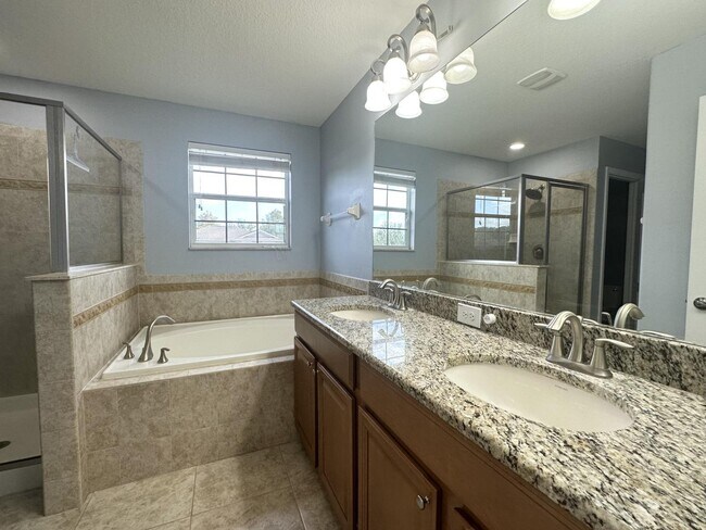 Building Photo - "Spacious 5-Bedroom Retreat with Scenic Views in The Verandahs!"