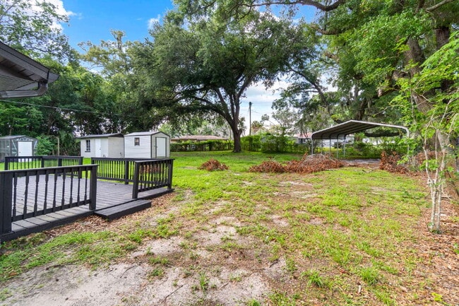 Building Photo - Gardener's Paradise! 3BR Home on Oversized Lot with Shed & Greenhouse