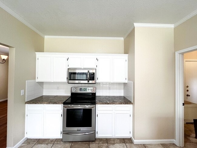 Building Photo - Available NOW!!!! This beautiful 2 story, 4 bedroom, 2 bath, two car garage with garage door open...