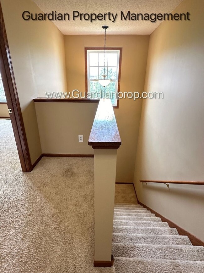 Building Photo - Pet Free Champlin Town Home, 3.5 Baths, 2 Car Garage, Dishwasher, Balcony, Available end of April