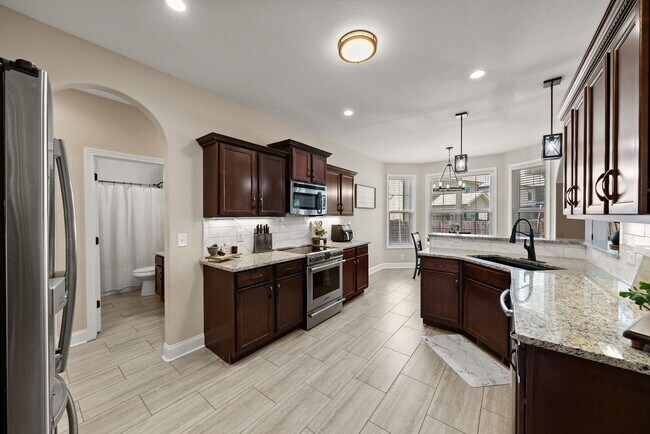 Building Photo - Pet Friendly Four Bedroom with Bonus!