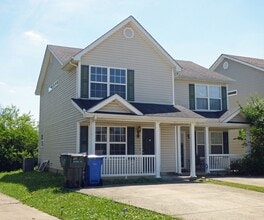 Building Photo - COMING SOON! Spacious Townhouse, W/D Hookups, Off-Street Parking, All Electric!