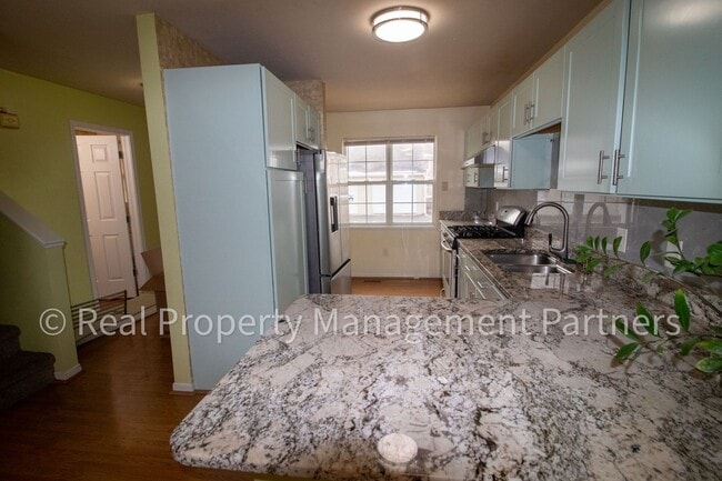 Building Photo - Forest Hills 3 Bed Townhome with Garage, Pond View and Some Utilities Included