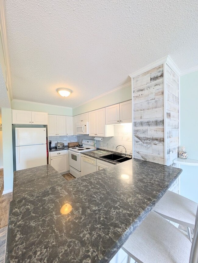 Building Photo - Dreamy Little River Condo — Furnished, Elevator Access, Pool & Marina Nearby!