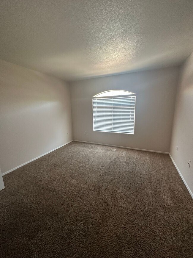 Building Photo - Cozy Condo with fireplace in living room.