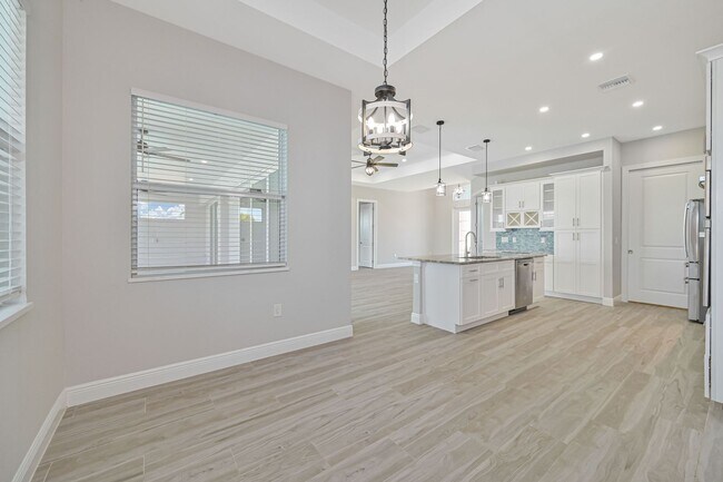 Building Photo - NOW AVAILABLE - Gorgeous Pool Home ~ NW Cape ~ 3 Car Garage ~ On Canal!