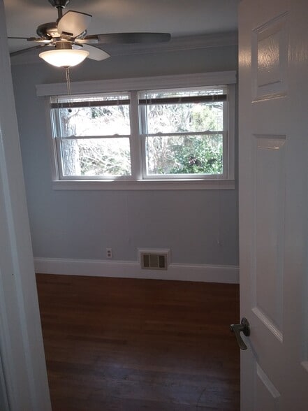 1st bedroom (showcasing windows) - 701 Rosalyn Dr