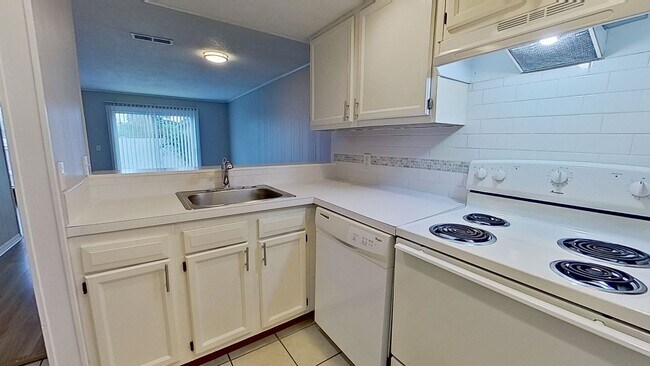 Building Photo - MOVE IN SPECIAL $500 OFF FIRST MONTH!! Beach Living at it's Best!  Two Bedroom/One Bath Ground Fl...