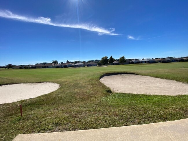 Building Photo - ANNUAL Lease – Unfurnished – Golf Course Lot - Designer Home in the highly sought-after gated com...