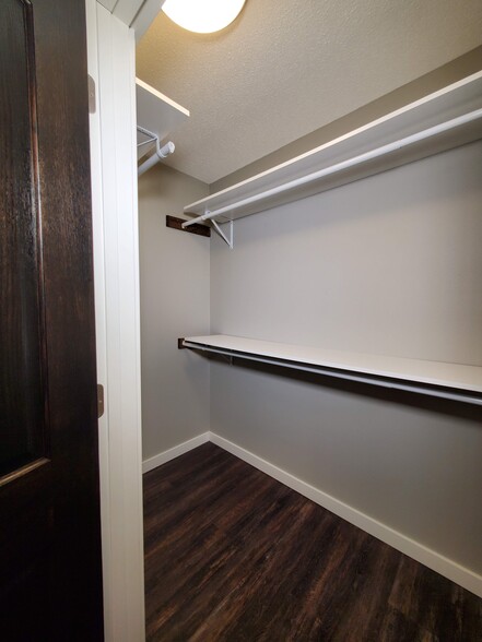 Walk-in closet in the master bedroom with great shelf and hanging space. - 2525 Cedar Hills Drive