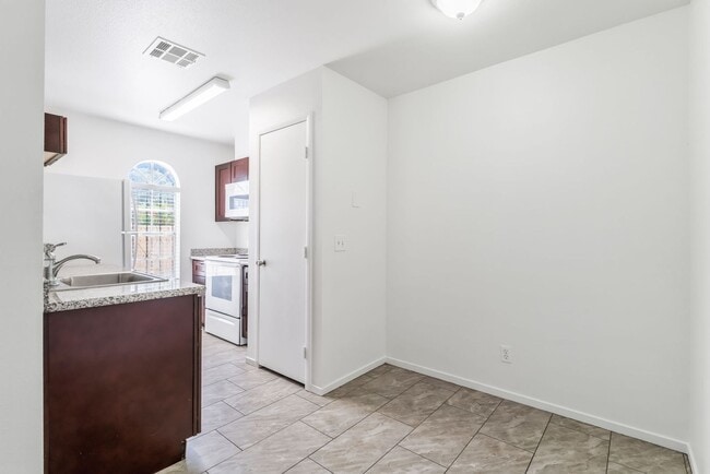 Building Photo - Modern Gated Condo Near the Strip with Pool & Covered Parking!
