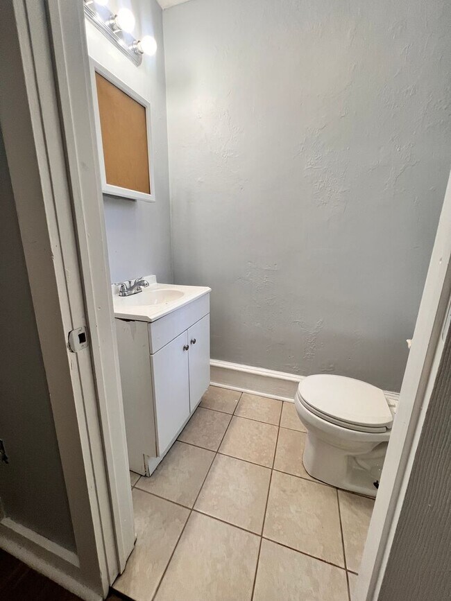Building Photo - Updated 3 Bedroom 1.5 Bath Townhome w/ Paved Yard + Washer & Dryer