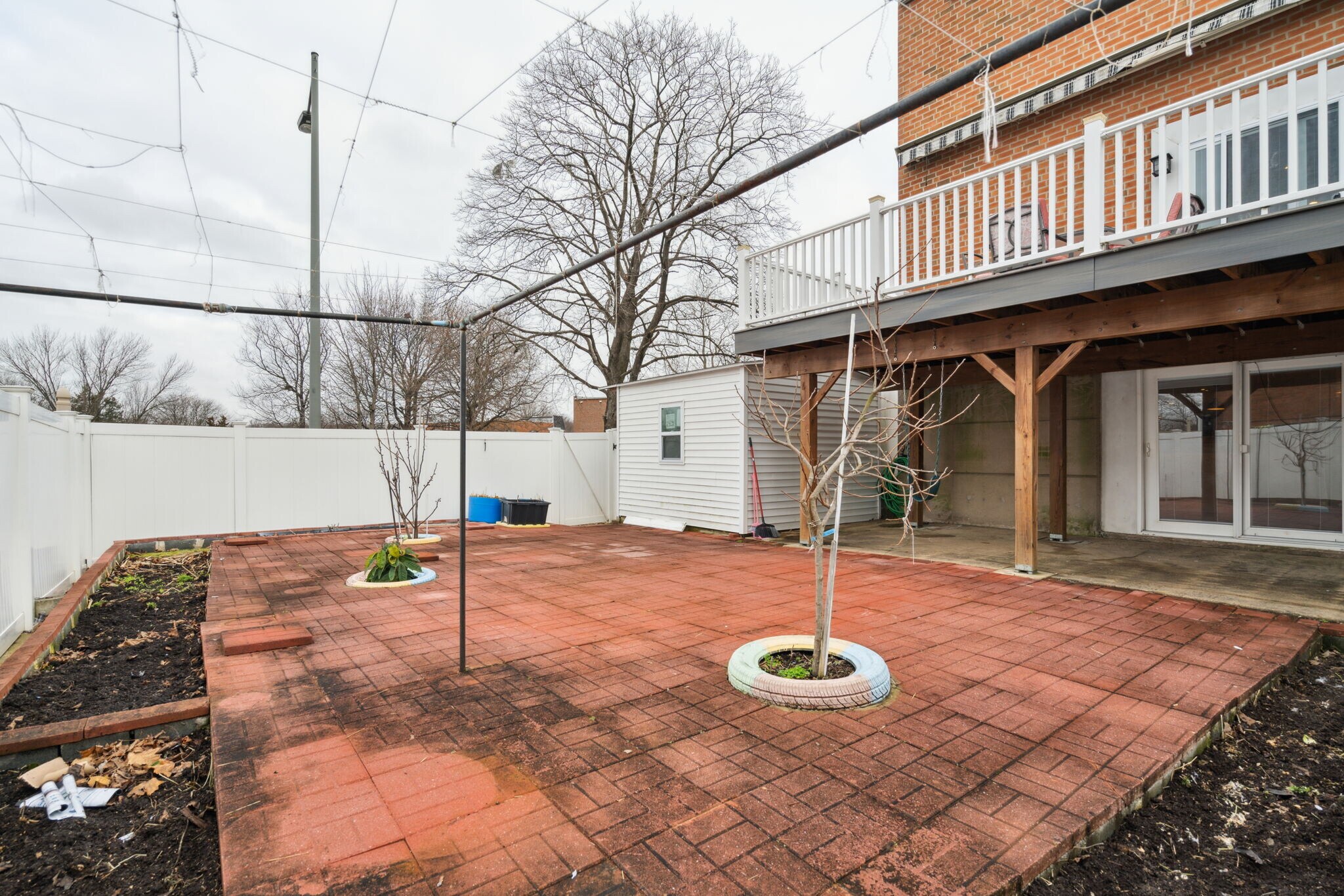 Backyard with Pavers, Fruit Trees and Garden Space - 100 Rennard Ter