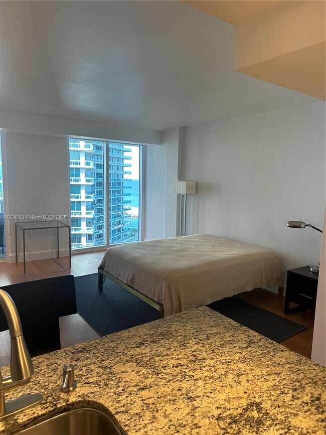 Building Photo - 10275 Collins Ave