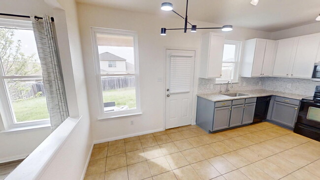 Building Photo - Expansive Living and Stylish Updates in So...