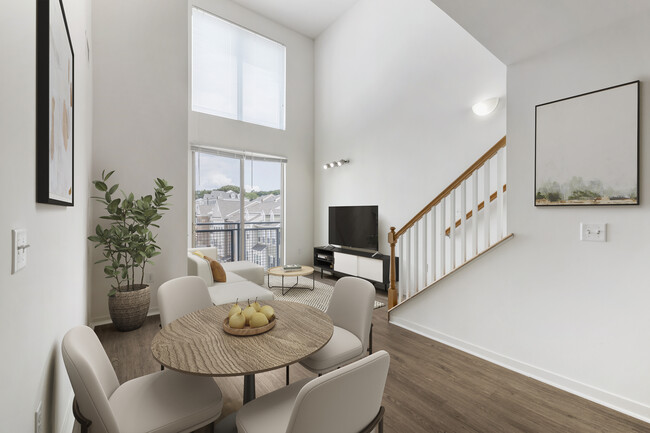 Renovated Package I dining and living room with hard surface flooring - Avalon at Wesmont Station