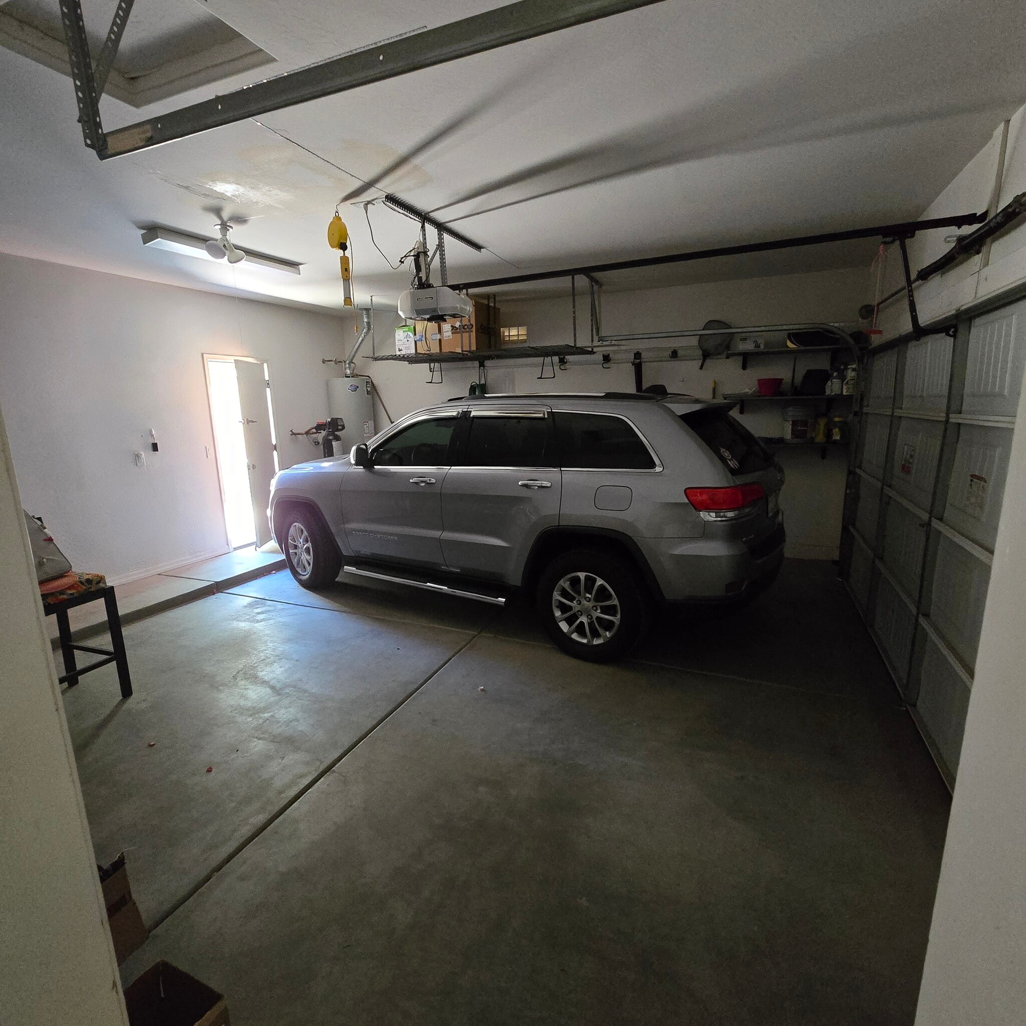 2-car garage with backyard access door and storage racks - 280 E Indigo Dr