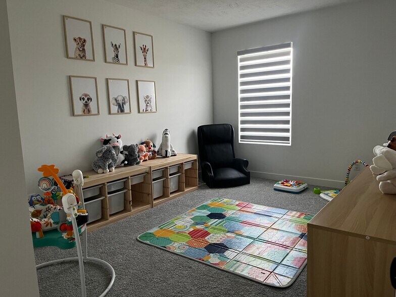 Upstairs bedroom (playroom) - 362 Jonagold Dr NE