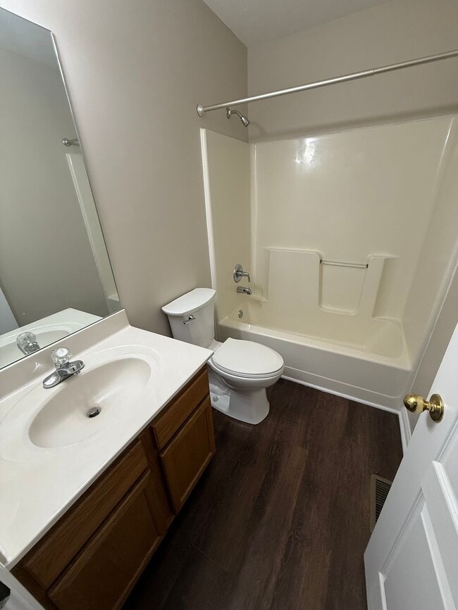 Building Photo - 2-bedroom, 1.5-bath townhouse with an attached garage