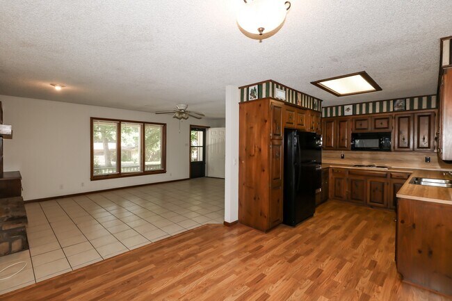 Building Photo - Two Bedroom, 2 Bath, 1-Car Garage, 1179 sq ft feet home with wood burning fireplace. and screened...