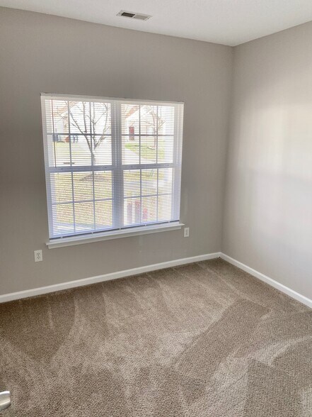 2nd bedroom downstairs with double windows, closet, and direct hall access to 2nd full bathroom! - 1914 Conifer Cir