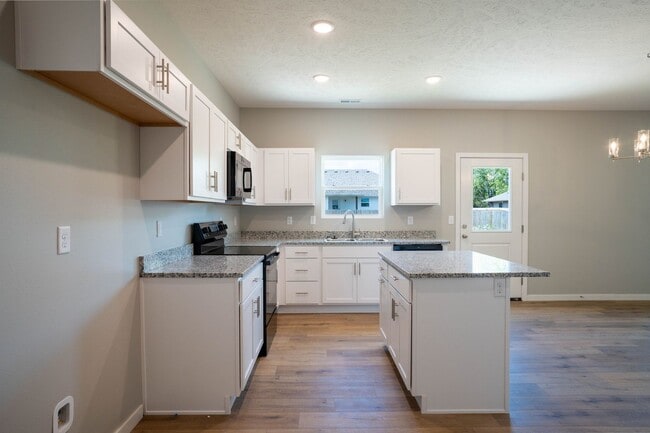 Building Photo - BRAND NEW 3 BEDROOM HOME WITH 3 CAR GARAGE