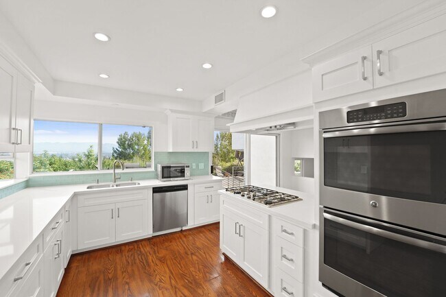 Building Photo - This stunning 5 Bed / 3 Bath Home South of Ventura Boulevard with pool and panoramic views is now...