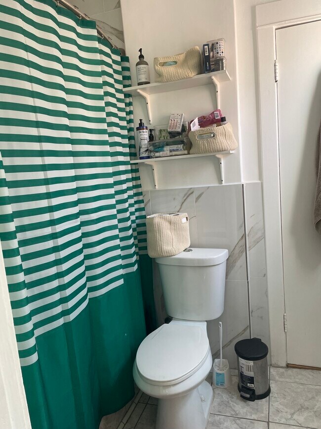 The shower is a full tub, as well. - 6619 Willoughby Ave