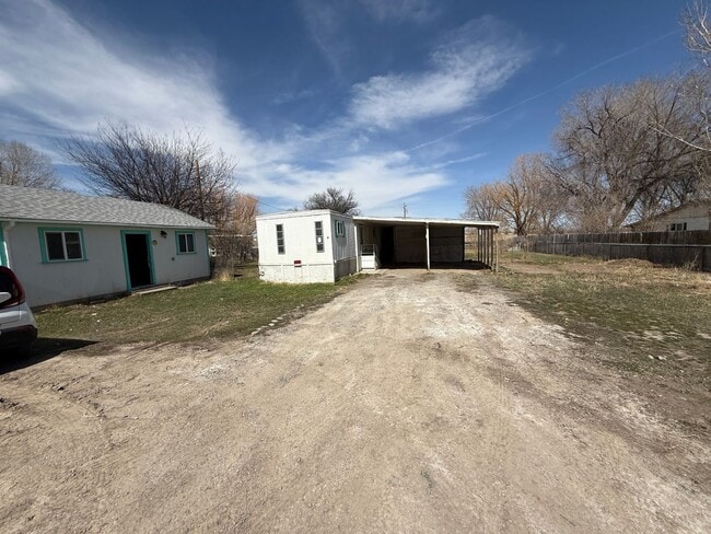 Building Photo - 2 Bedroom 1.5 Semi-Rural Mobile Home with Workshop on Large Lot